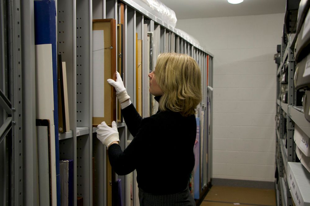 3)	The Dax Centre Gallery Coordinator in the collection archive room. Courtesy of The Dax Centre.