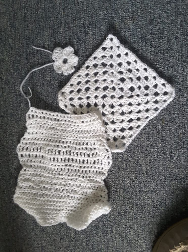 my not straight practice crocheting,  A cute little flower, and probably the best granny square I have ever done.